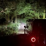 Stealth led lights shining high performance lighting down a country road at night